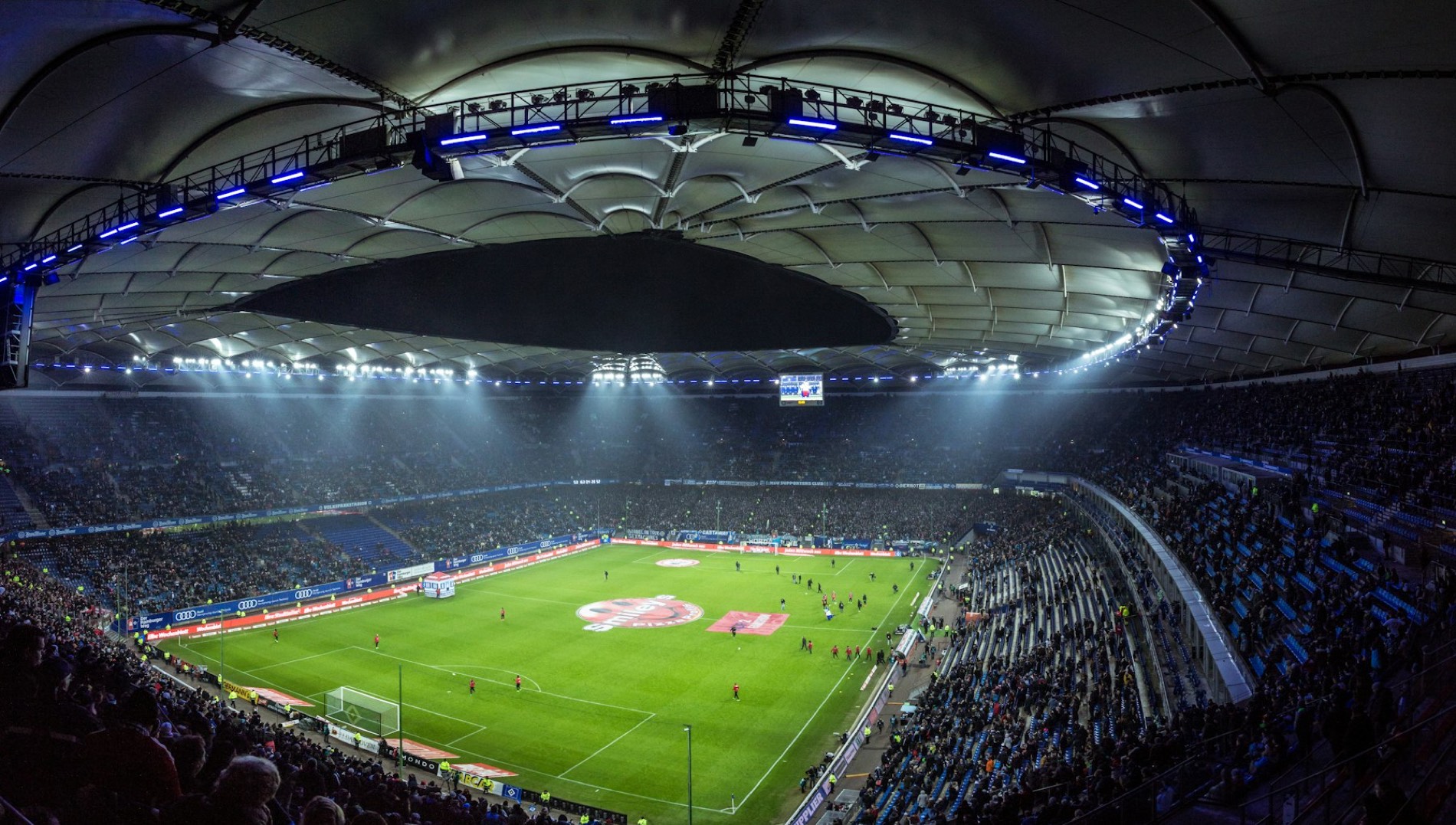 Floodlit stadium on a matchday